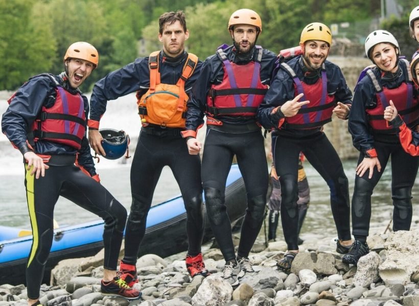 group-of-playful-friends-at-a-rafting-class-posing-at-boat-e1645648125493.jpg